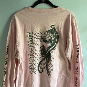 light pink "rest easy" long sleeve shirt with panther graphic